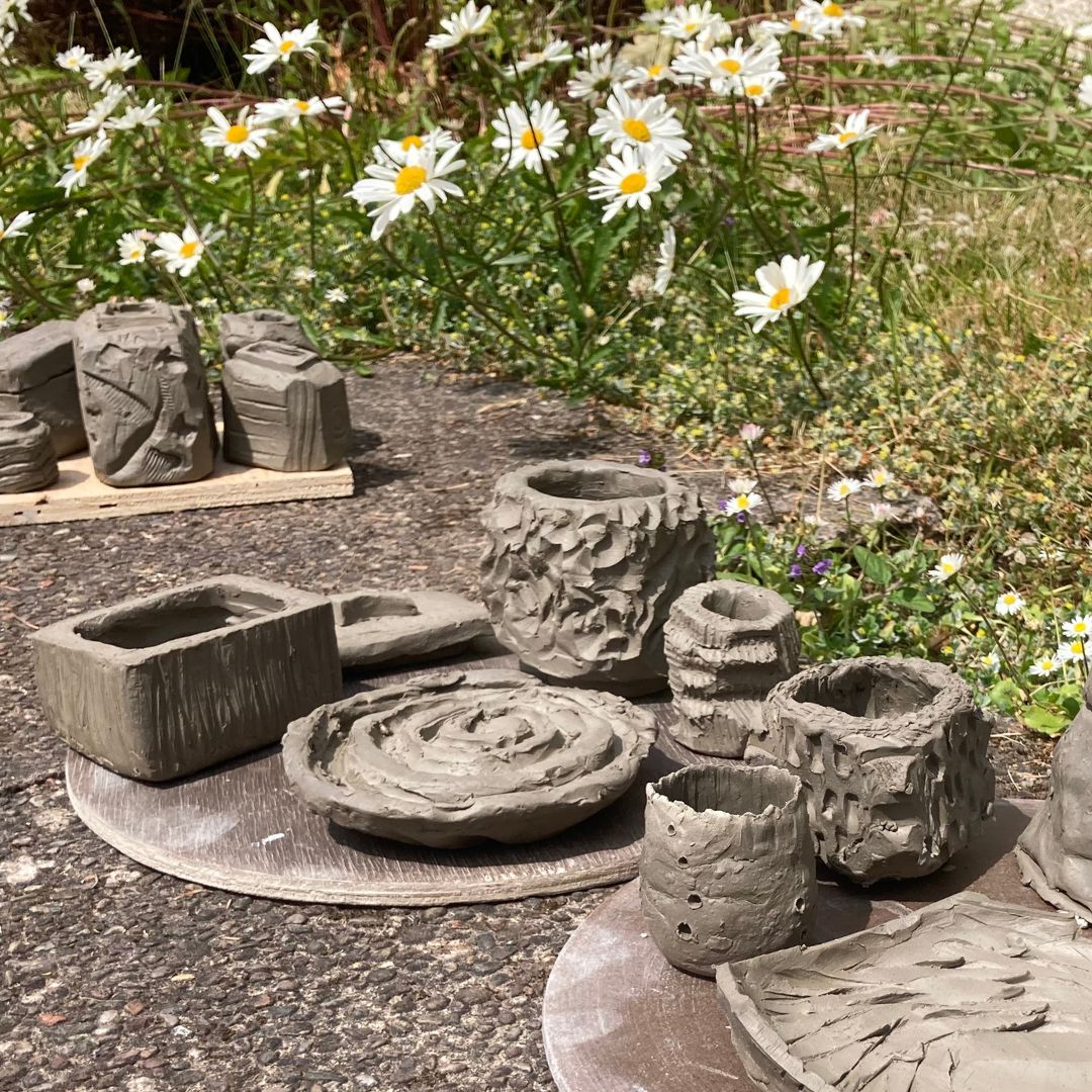 Various carved clay pots