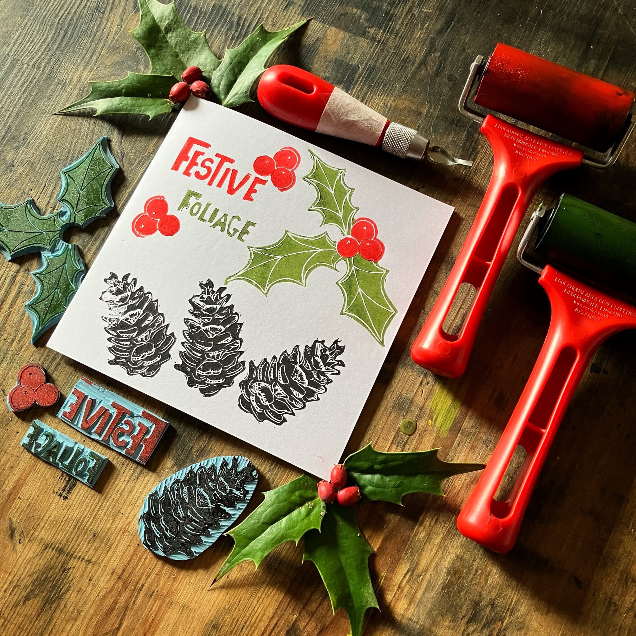 Lino cut tools and card that reads Festive Foliage