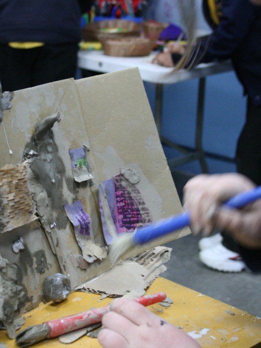 Hand_using_clay_slip